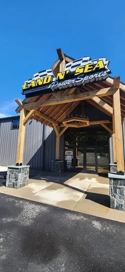 Low-angle shot of the clean stone and wood finishes resulting from timber entryway power washing.